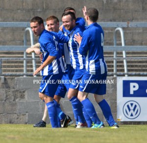Newry players celebrate first NCAFC win.