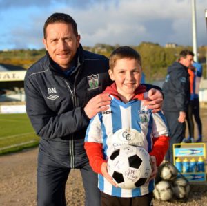 Manager Darren Mullen with Match day Mascot Aaron Shields. Photograph courtesy of Brendan Monaghan Photography