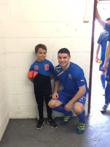 Match Day Mascot Conor Young with Captain Chris McMahon